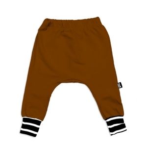 New in package size 5/6 Whistle and Flute rust coloured cuffed joggers